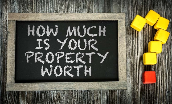 How Much is Your Property Worth on chalkboard