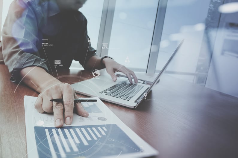 Businessman working with mobile phone and digital tablet and lap