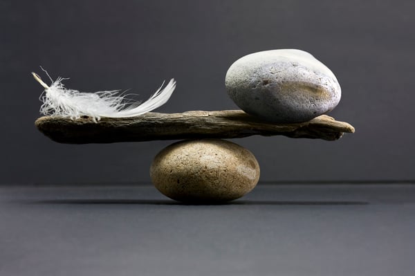 Feather and stone balance