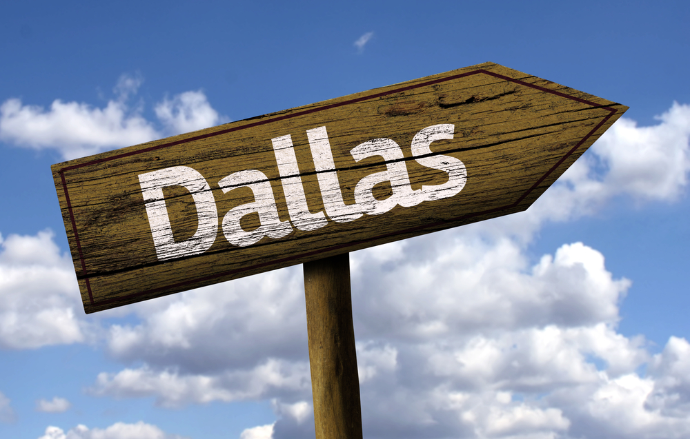 Dallas wooden sign on a beautiful day