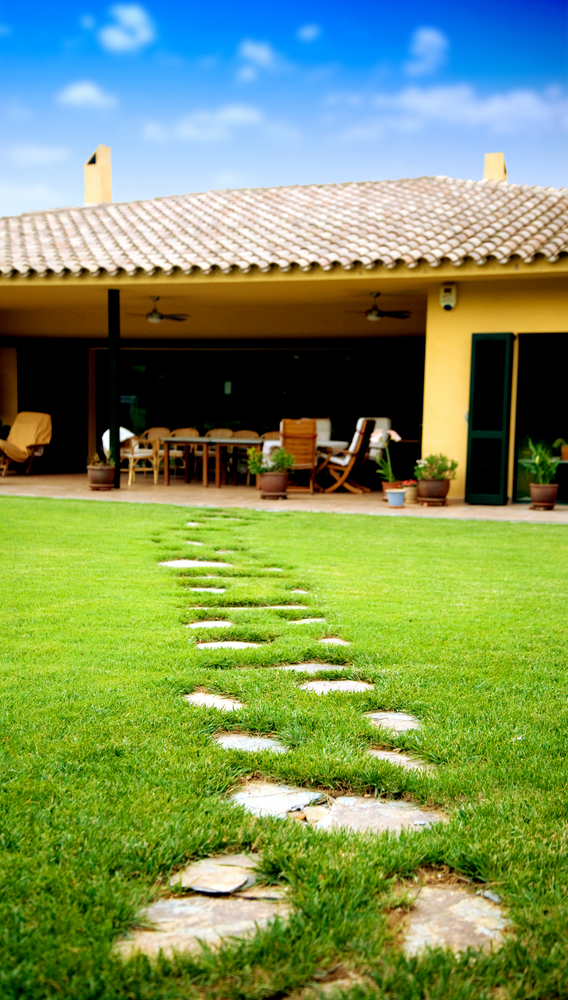 stone path leading to a beautiful summer house