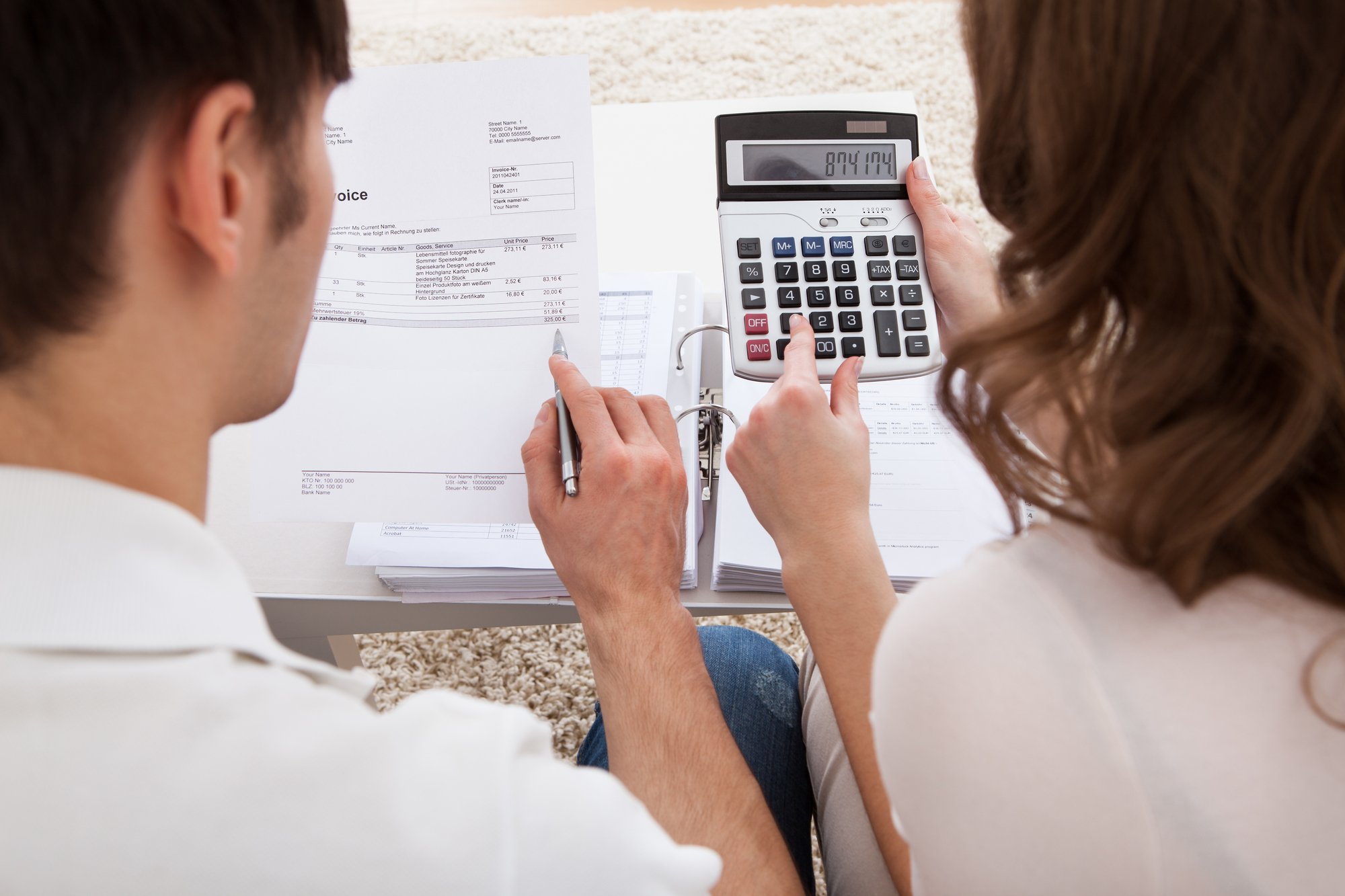 Young couple calculating budget