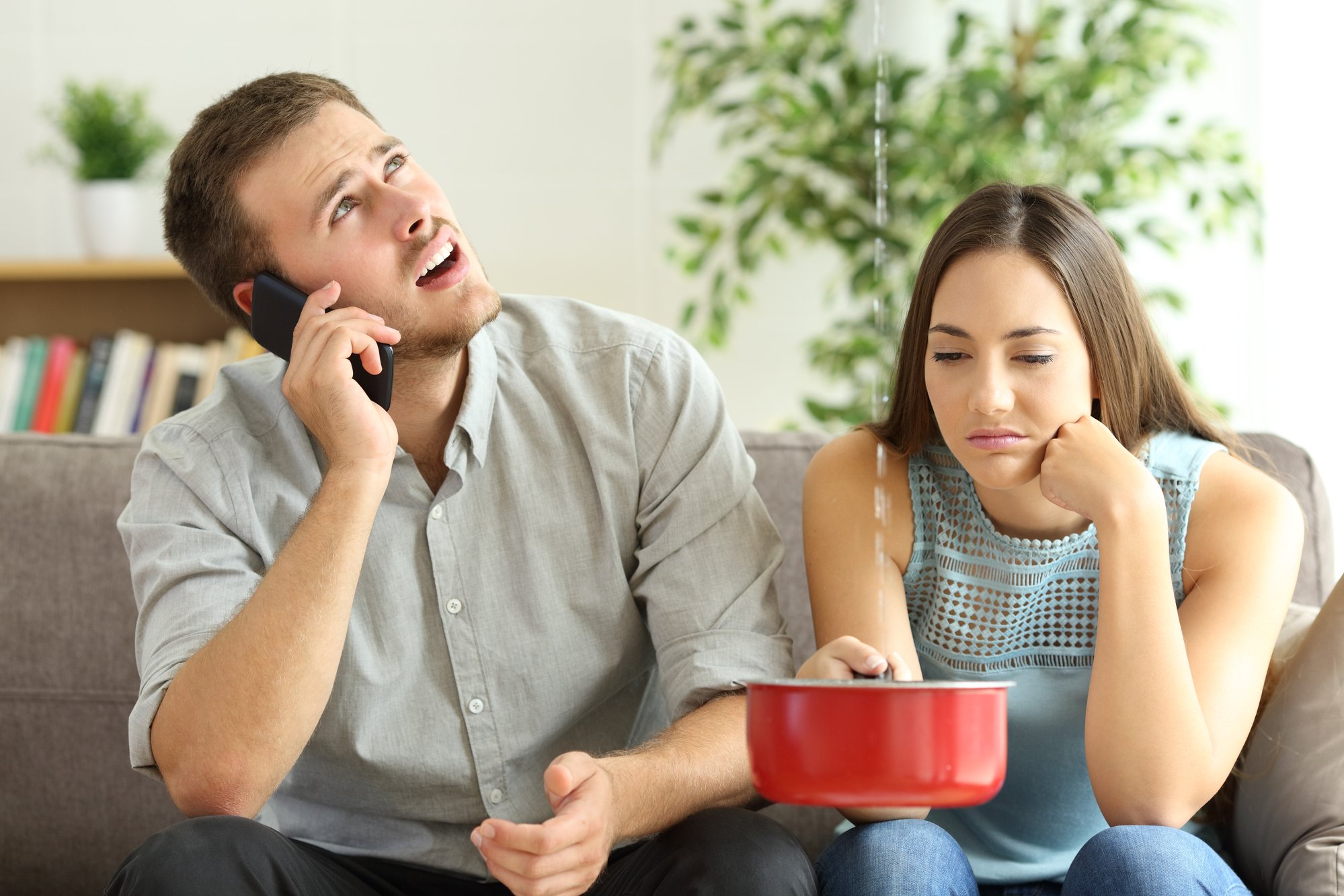 couple calling insurance for home